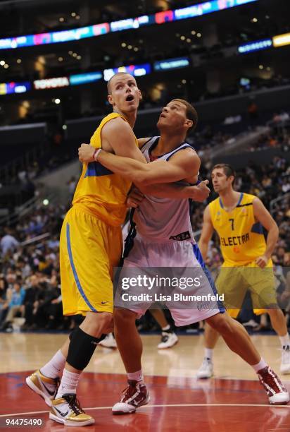 Maciej Lampe of the Maccabi Electra Tel Aviv and Blake Griffin of the Los Angeles Clippers battle for position during a preseason game at Staples...