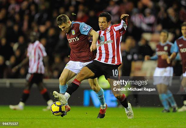 James Milner of Aston Villa battles with Kieran Richardson of Sunderland during the Barclays Premier League match between Sunderland and Aston Villa...