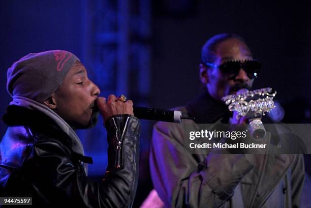 Musician Pharrell Williams and musician Snoop Dogg perform on stage at the party to celebrate Famous Stars & Straps 10-year anniversary and Snoop...