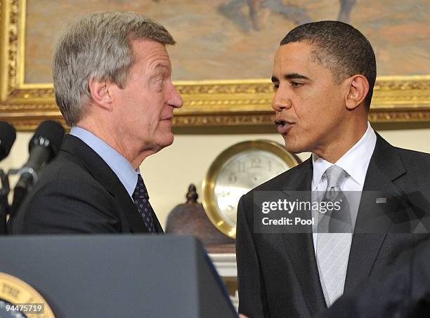 President Barack Obama speaks with Sen. Max Baucus after making a statement to the press in the Roosevelt Room in the Eisenhower Executive Office...