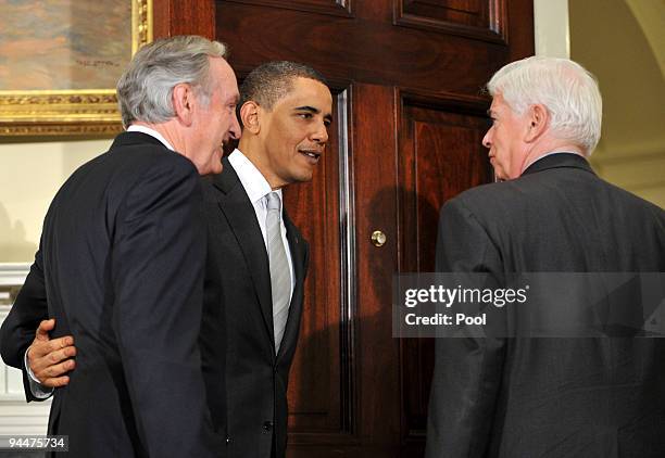 President Barack Obama walks out with Sen. Tom Harkin and Sen. Chris Dodd after speaking to the press in the Roosevelt Room in the Eisenhower...