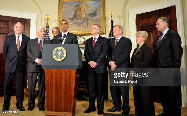 President Barack Obama speaks to the press flanked by Sen. Tom Harkin , Sen. Chris Dodd , Sen. Max Baucus , Senate Majority Leader Harry Reid , Sen....