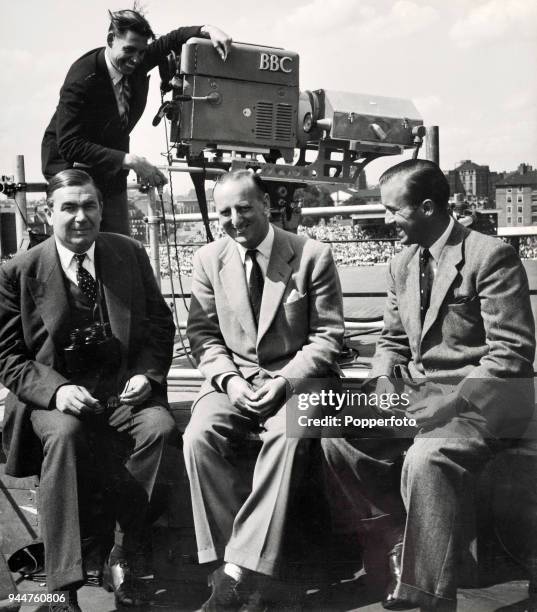 Commentators posing for a photograph on the roof of the pavilion at the Oval cricket ground in London during the 5th Test match between England and...