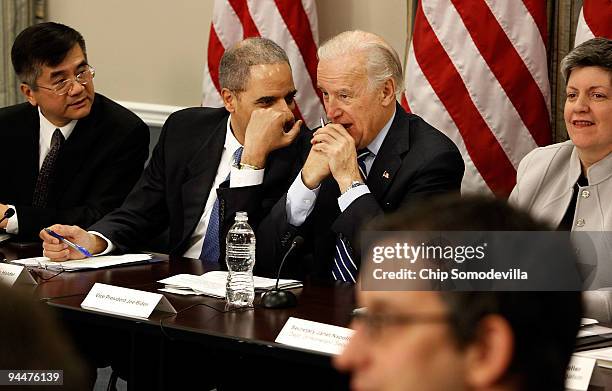 Vice President Joe Biden speaks with Attorney General Eric Holder during a roundtable discussion on the Obama Administration�s commitment to...