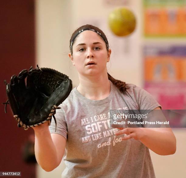 Senior Jordan Boucher practices with the Noble High School softball team in a gym at the high school in North Berwick on Thursday, April 5, 2018.