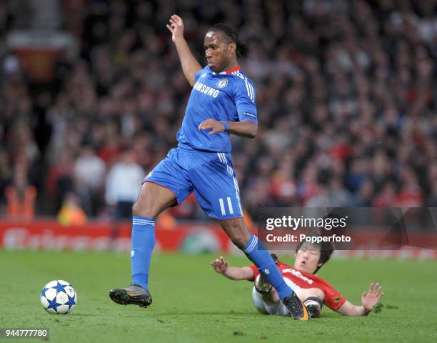 Didier Drogba of Chelsea evades Ji-Sung Park of Manchester United during the UEFA Champions League Quarter-Final second leg match between Manchester...