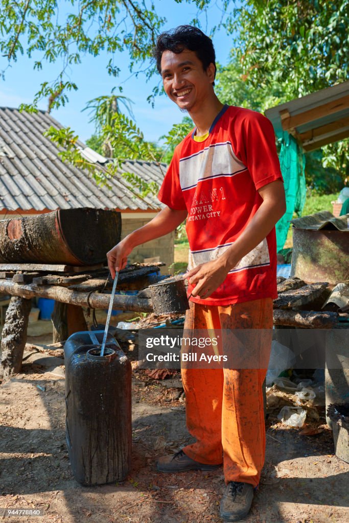 Testing the latex brought in by rubber tappers