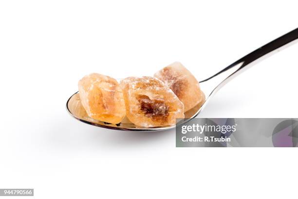 brown caramelized sugar in spoon - hyperglycemia stock pictures, royalty-free photos & images