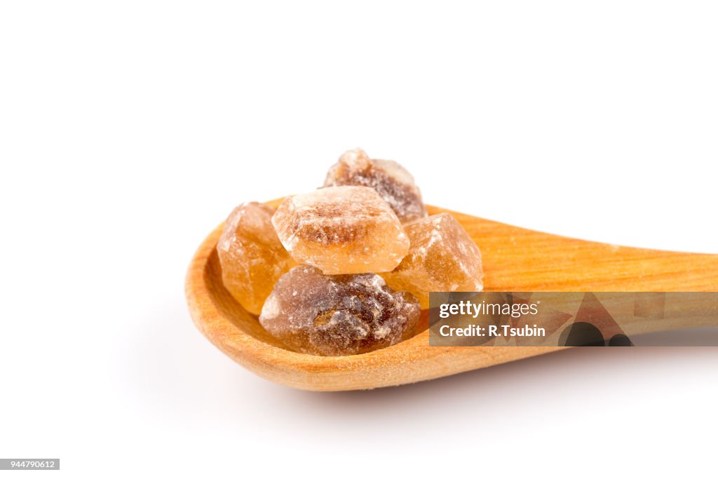 Brown caramelized sugar in spoon