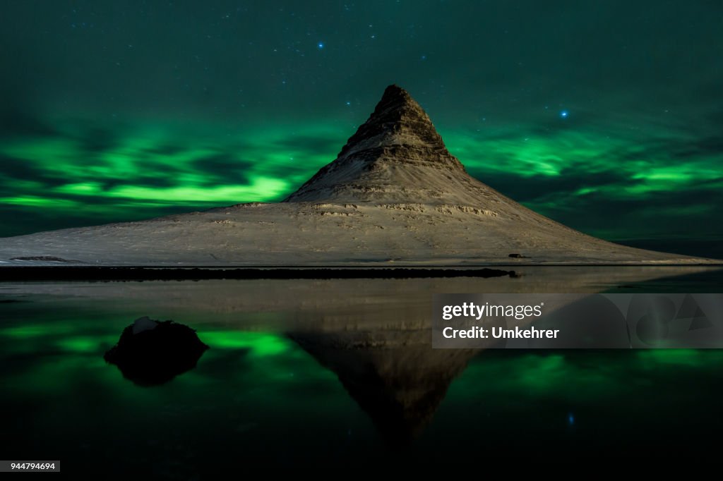 Mount kirkjufell in iceland with aurora borealis