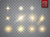 Golden lights sparkles collection. Vector illustration of glowing lens flares, flashes and sparks