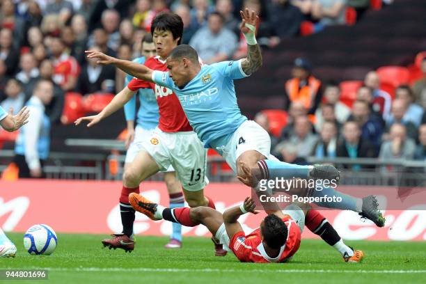 Nigel de Jong of Manchester City clashes with Nani of Manchester United during the FA Cup sponsored by E.ON semi final match between Manchester City...