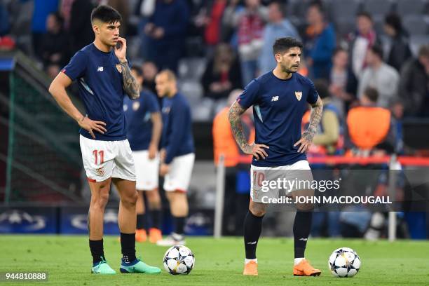 Sevilla's Argentinian midfielder Ever Banega and Sevilla's Argentinian midfielder Joaquin Correa warm up on the ball prior to the UEFA Champions...