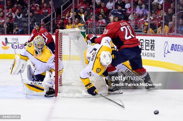 Matt Irwin of the Nashville Predators and Lars Eller of the Washington Capitals collide in the third period at Capital One Arena on April 5, 2018 in...