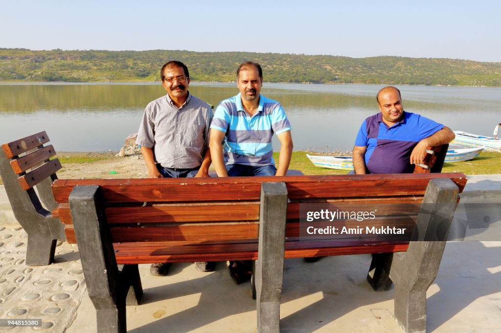Three friends enjoying weekend on lake