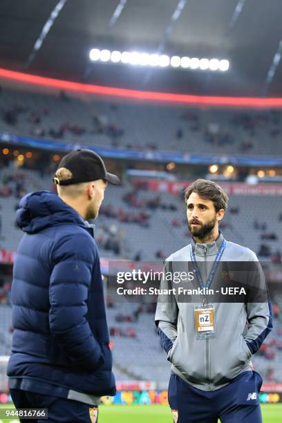 Nicolas Pareja of Sevilla talks to teammate Johannes Geis of Sevilla prior to the UEFA Champions League Quarter Final Second Leg match between Bayern...