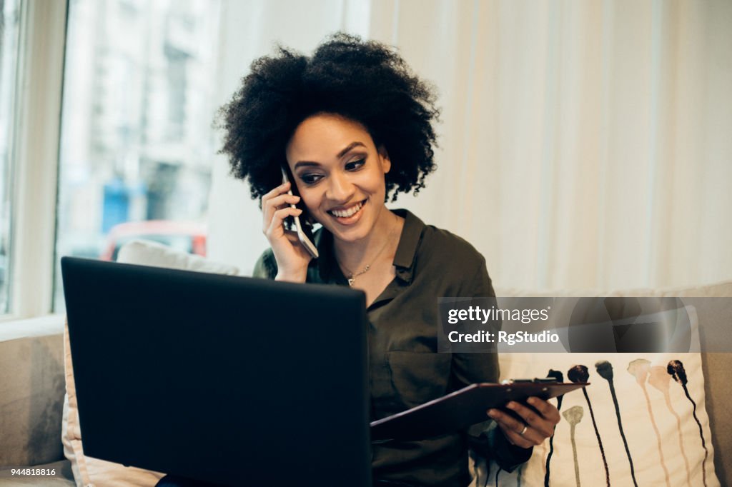 Happy woman using modern technology