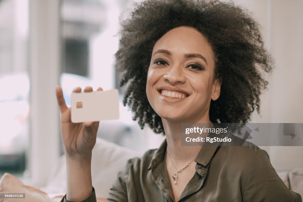 Pretty woman holding credit card