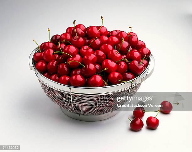 cherries in colander - bing cherry stock pictures, royalty-free photos & images