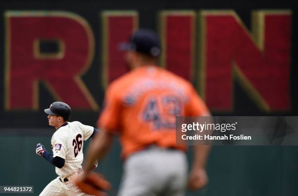 Lance McCullers Jr. #43 of the Houston Astros looks on as Max Kepler of the Minnesota Twins rounds the bases after hitting a two-run home run during...