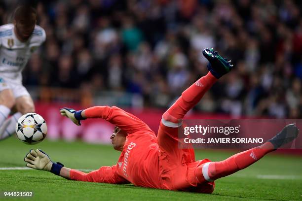 Real Madrid's Costa Rican goalkeeper Keylor Navas dives for the ball during the UEFA Champions League quarter-final second leg football match between...