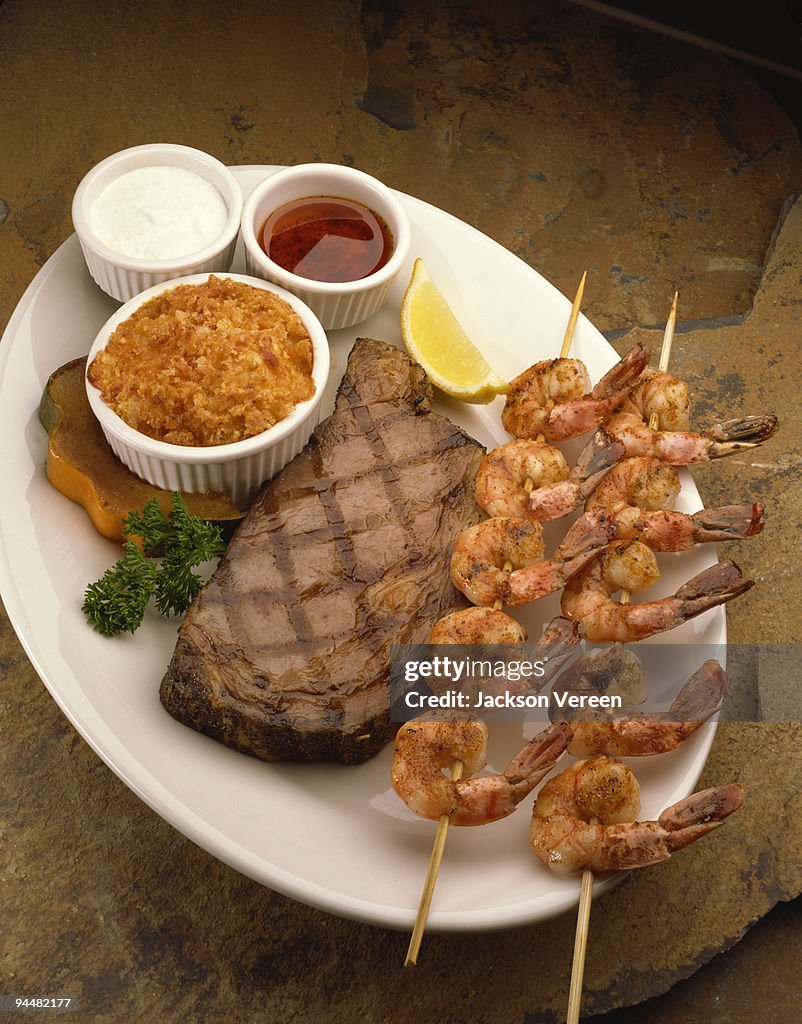 Shrimp kebabs and steak