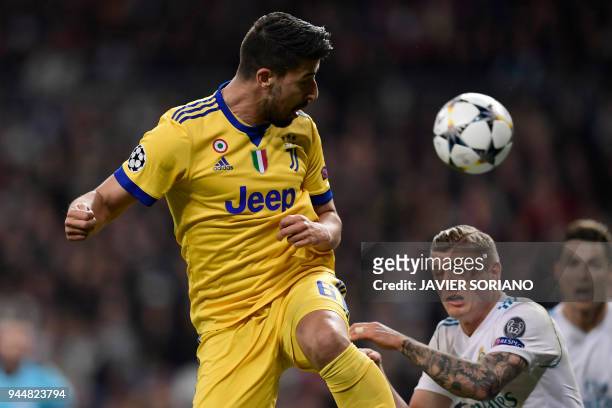 Juventus' German midfielder Sami Khedira vies with Real Madrid's German midfielder Toni Kroos during the UEFA Champions League quarter-final second...