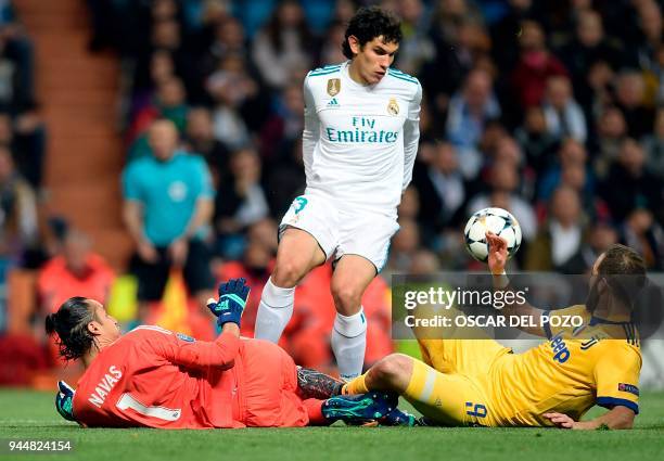 Juventus' Argentinian forward Gonzalo Higuain vies with Real Madrid's Spanish defender Jesus Vallejo and Real Madrid's Costa Rican goalkeeper Keylor...