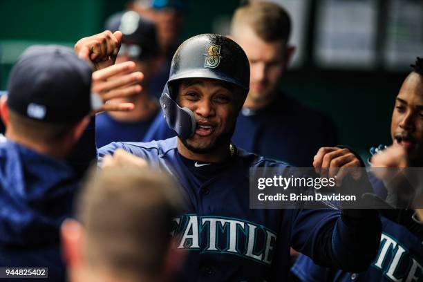 Robinson Cano of the Seattle Mariners celebrates scoring a run during the first inning against the Kansas City Royals at Kauffman Stadium on April...
