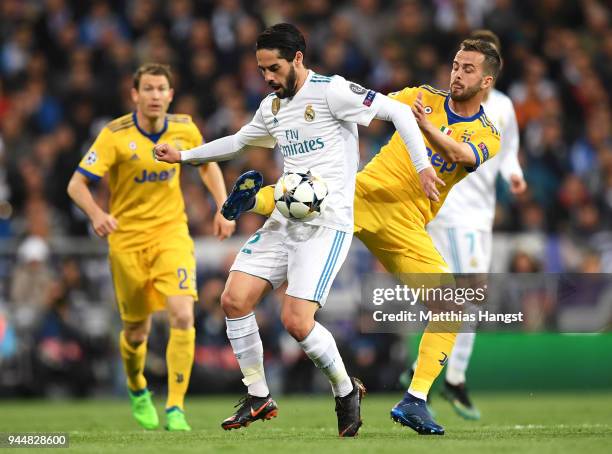 Isco of Real Madrid is challenged by Clement Lenglet of Sevilla during the UEFA Champions League Quarter Final Second Leg match between Real Madrid...