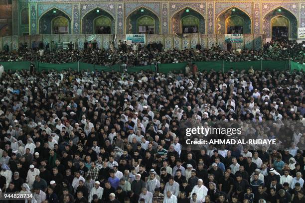 Shiite Muslim worshippers pray at the Imam Musa al-Kadhim's mosque in the Iraqi capitals northern district of Kadhimiya on April 11 ahead of marking...