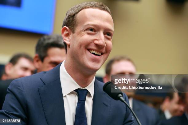 Facebook co-founder, Chairman and CEO Mark Zuckerberg smiles at the conclusion of his testimony before the House Energy and Commerce Committee in the...