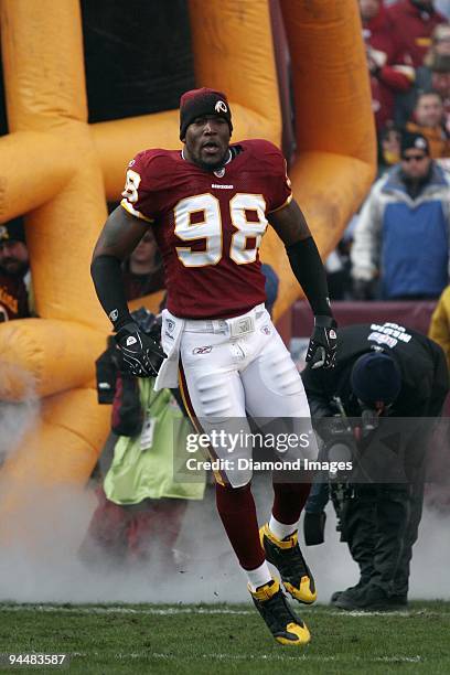 Defensive lineman Brian Orakpo of the Washington Redskins jogs onto the field prior to a game on December 6, 2009 against the New Orleans Saints at...