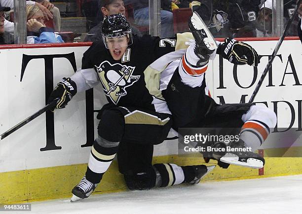 Arron Asham of the Philadelphia Flyers flips over Evgeni Malkin of the Pittsburgh Penguins at the Mellon Arena on December 15, 2009 in Pittsburgh,...