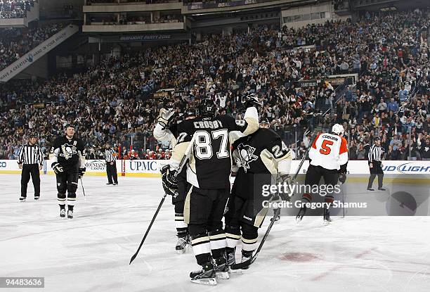 Sidney Crosby of the Pittsburgh Penguins celebrates his goal with teammates against the Philadelphia Flyers on December 15, 2009 at Mellon Arena in...