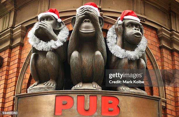 Christmas decorations are seen on the Monkeys at the entry to the 3 Wise Monkeys Pub on George street as Sydney prepares for Christmas on December...