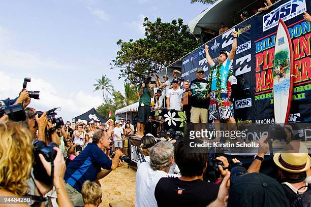 Taj Burrow of Australia celebrates his victory during the prize giving of the Billabong Pipeline Masters on December 15, 2009 in Pipeline, Hawaii.