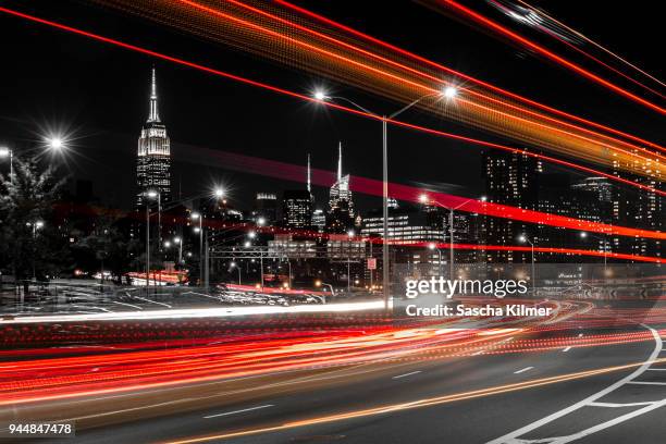 new york city, fdr drive at night, light trails - nyc nightlife stock pictures, royalty-free photos & images