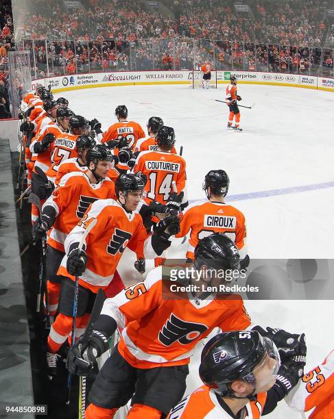 Claude Giroux, Sean Couturier, Ivan Provorov and Michael Raffl of the Philadelphia Flyers celebrate a first period goal with teammates against the...