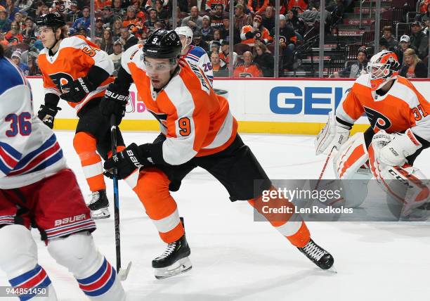 Ivan Provorov, Oskar Lindblom and Brian Elliott of the Philadelphia Flyers in action against the New York Rangers on April 7, 2018 at the Wells Fargo...