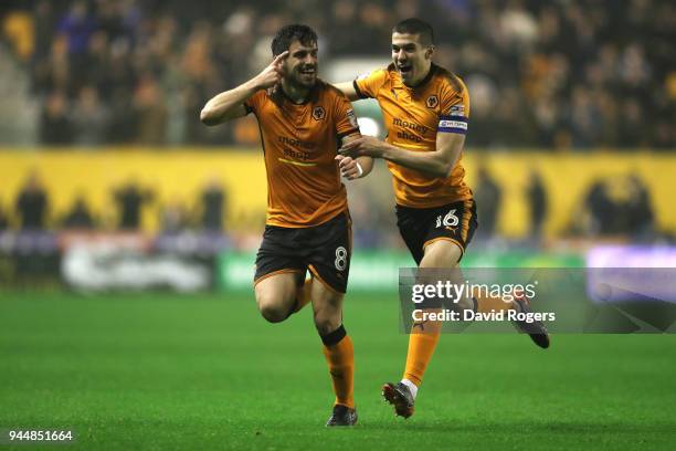 Ruben Neves of Wolverhampton Wanderers celebrates with teammate Conor Coady after scoring his sides second goal during the Sky Bet Championship match...