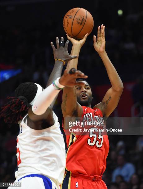 Montrezl Harrell of the Los Angeles Clippers defends a shot by E'Twaun Moore of the New Orleans Pelicans during the game at Staples Center on April...