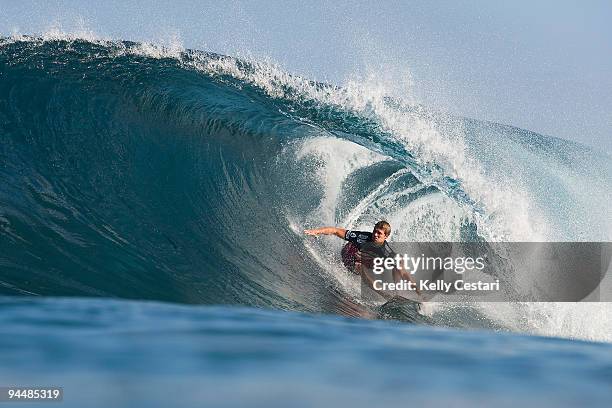 Damien Hobgood of the United States surfs on his way to elimination in the Quarter Finals of the Billabong Pipeline Masters on December 15, 2009 at...