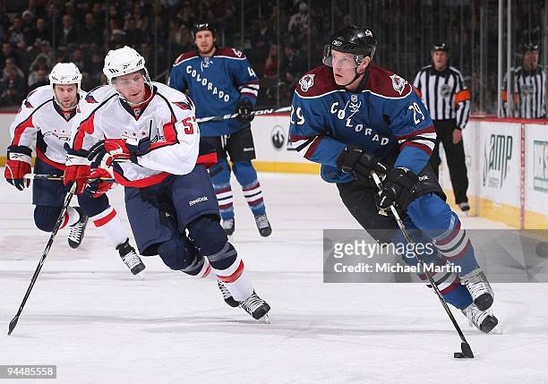Ryan Stoa of the Colorado Avalanche skates against Kyle Wilson of the Washington Capitals at the Pepsi Center on December 15, 2009 in Denver,...