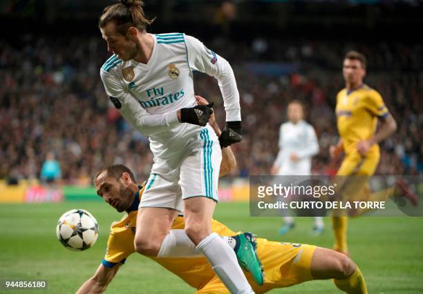 Real Madrid's Welsh forward Gareth Bale vies with Juventus' Italian defender Giorgio Chiellini during the UEFA Champions League quarter-final second...