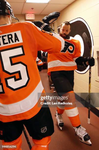 Radko Gudas and Jori Lehtera of the Philadelphia Flyers prepare for warm-ups outside the locker room prior to playing the New York Rangers on April...