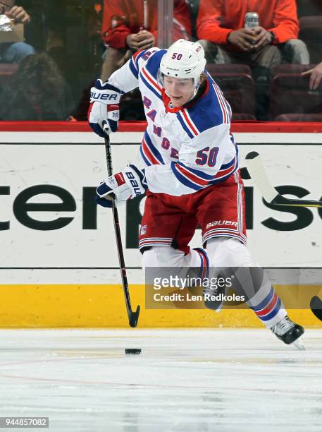 Lias Andersson of the New York Rangers skates the puck against the Philadelphia Flyers on April 7, 2018 at the Wells Fargo Center in Philadelphia,...
