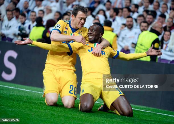 Juventus' French midfielder Blaise Matuidi celebrates a goal with Juventus' Swiss defender Stephan Lichtsteiner during the UEFA Champions League...