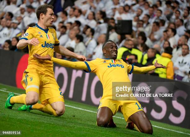 Juventus' French midfielder Blaise Matuidi celebrates a goal with Juventus' Swiss defender Stephan Lichtsteiner during the UEFA Champions League...
