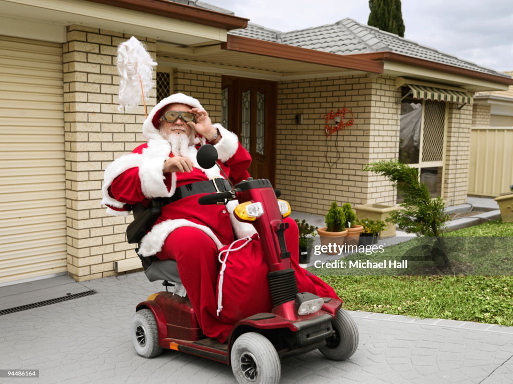 Santa Using A Walker Santa On Mobility Scooter High-Res Stock Photo - Getty Images